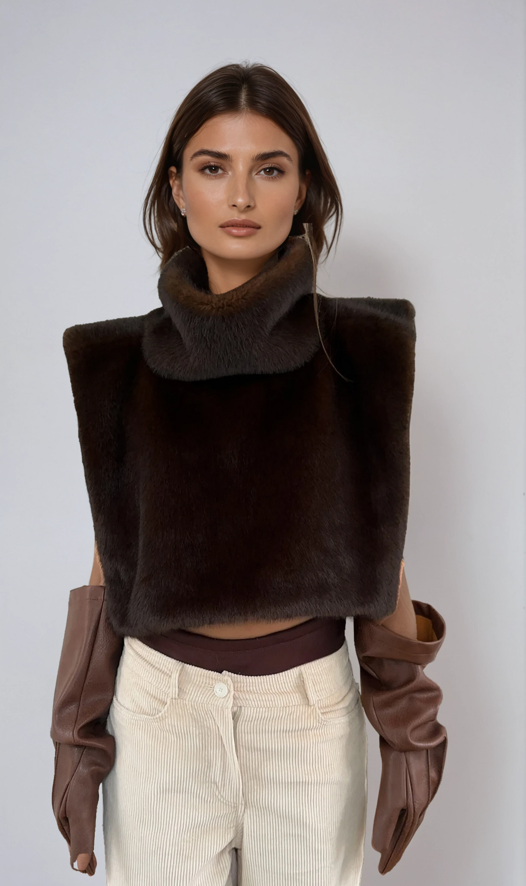 Dark brown luxurious faux fur turtleneck vest for women. Perfect winter outerwear.