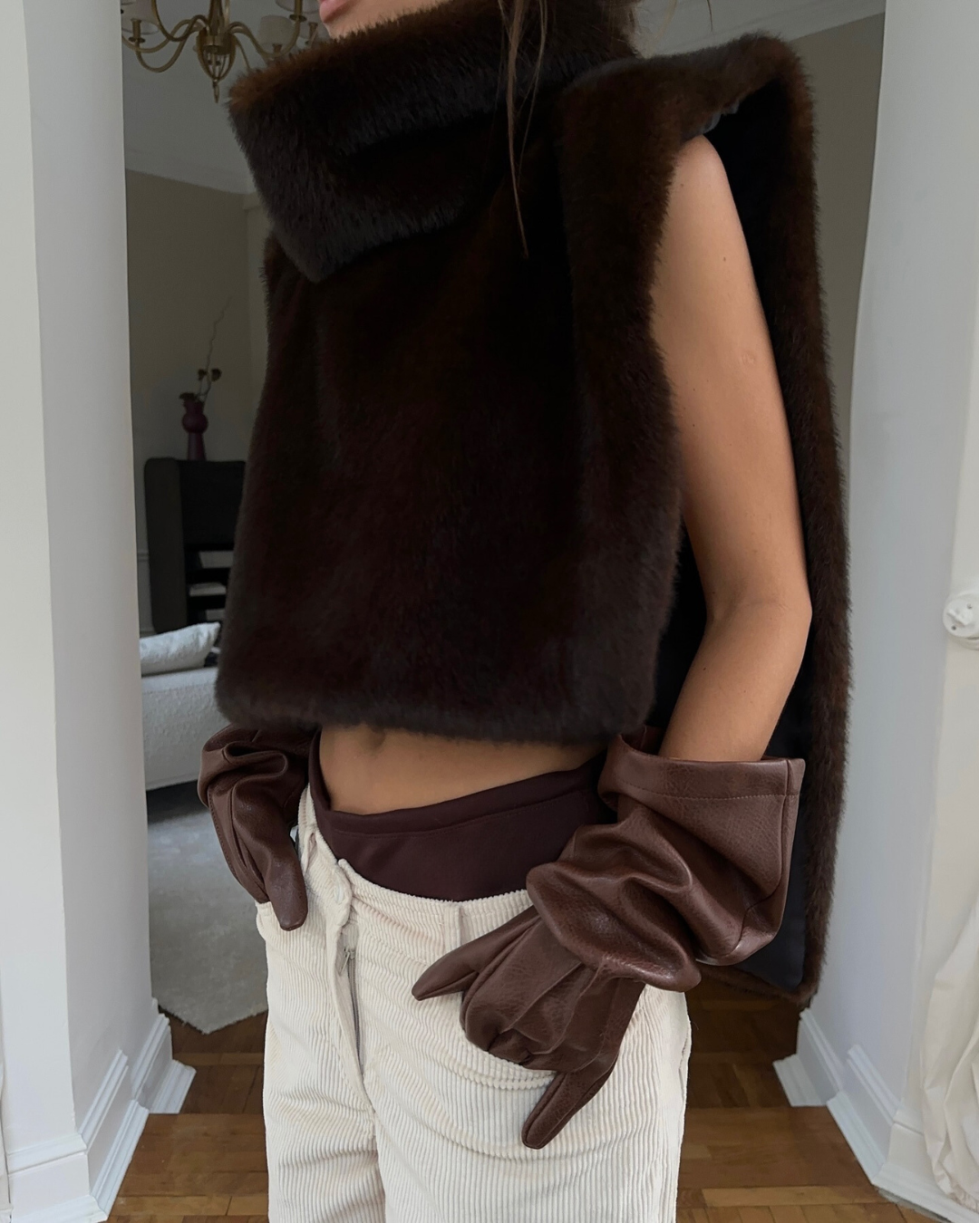 Luxe dark brown faux fur turtleneck vest, a women's sleeveless outerwear for winter luxury.