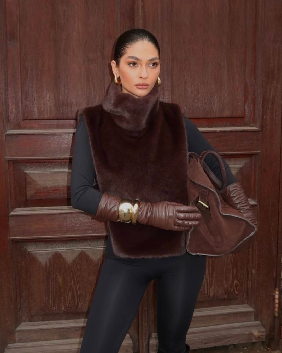 Women's dark brown faux fur turtleneck vest. Luxurious, sleeveless winter fashion outerwear.