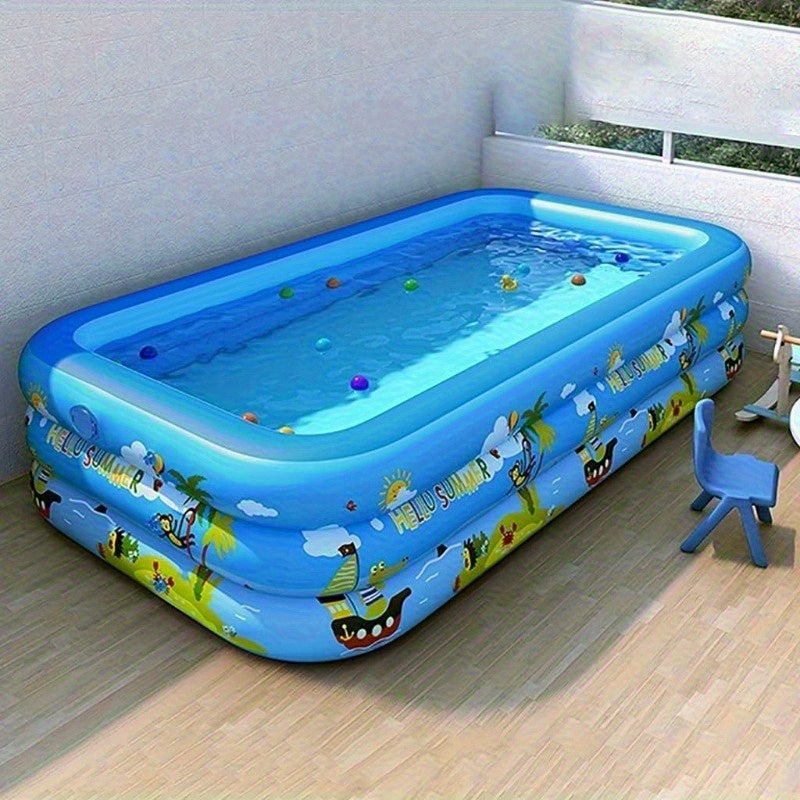 Kids enjoying refreshing summer fun in a durable ocean theme inflatable paddling pool in the garden.