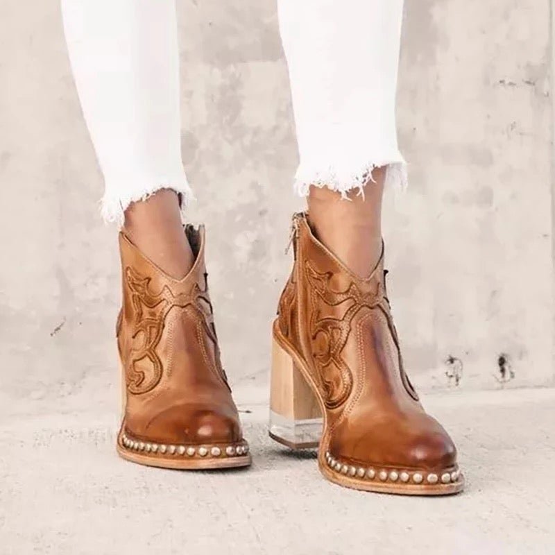 Elegant women's cut-out cowboy ankle boots, designed with a block heel for a chic western look.