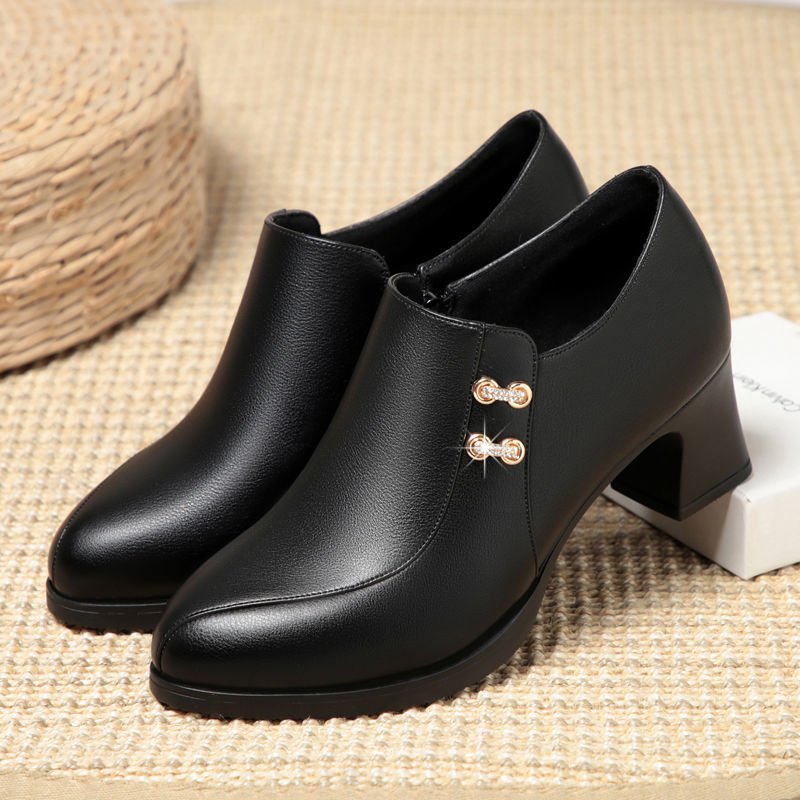 Stylish women's leather ankle boots; chic footwear with comfortable block heel for everyday fashion.