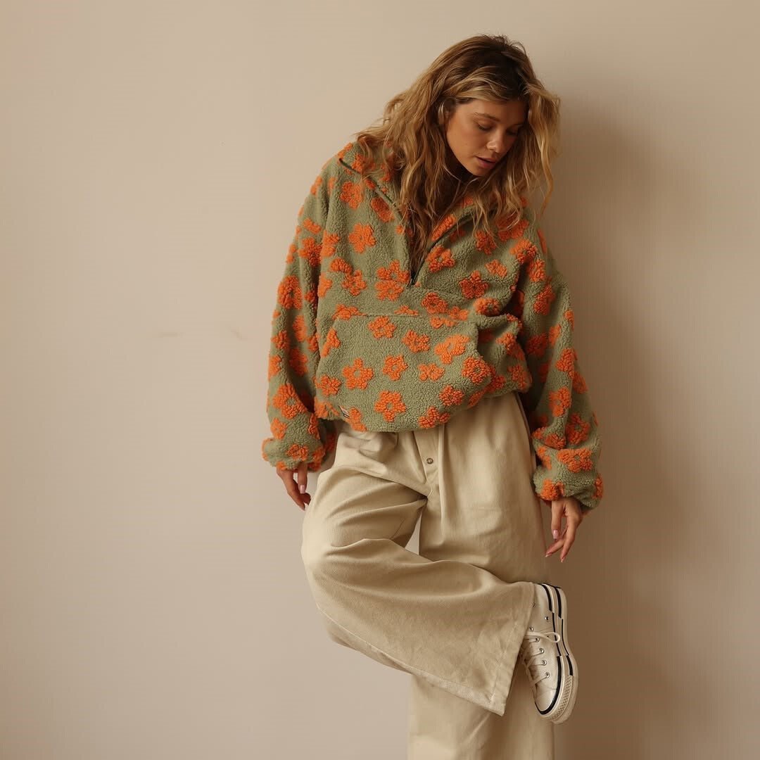 Comfortable women's floral oversized half-zip sweater, a versatile pullover perfect for cozy relaxed days.