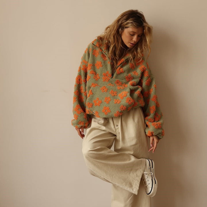 Comfortable women's floral oversized half-zip sweater, a versatile pullover perfect for cozy relaxed days.