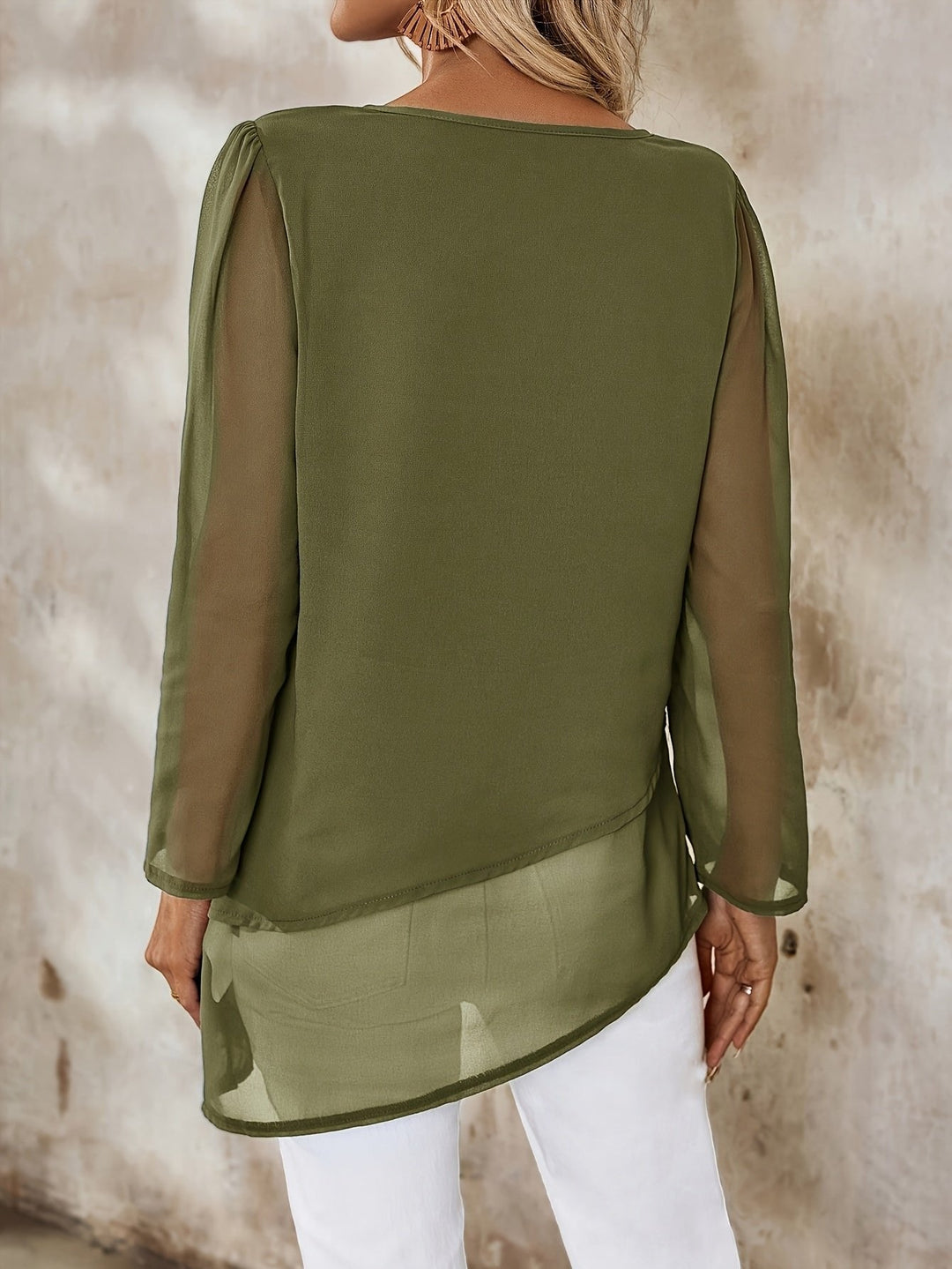 Elegant long sleeve blouse for women, featuring a flowing, layered design.