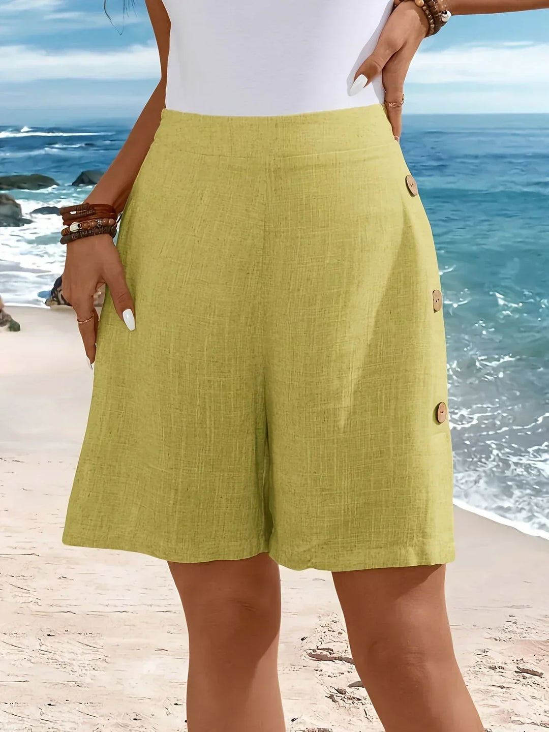 Close-up of the stylish button-front closure on women's high-waisted comfort shorts.