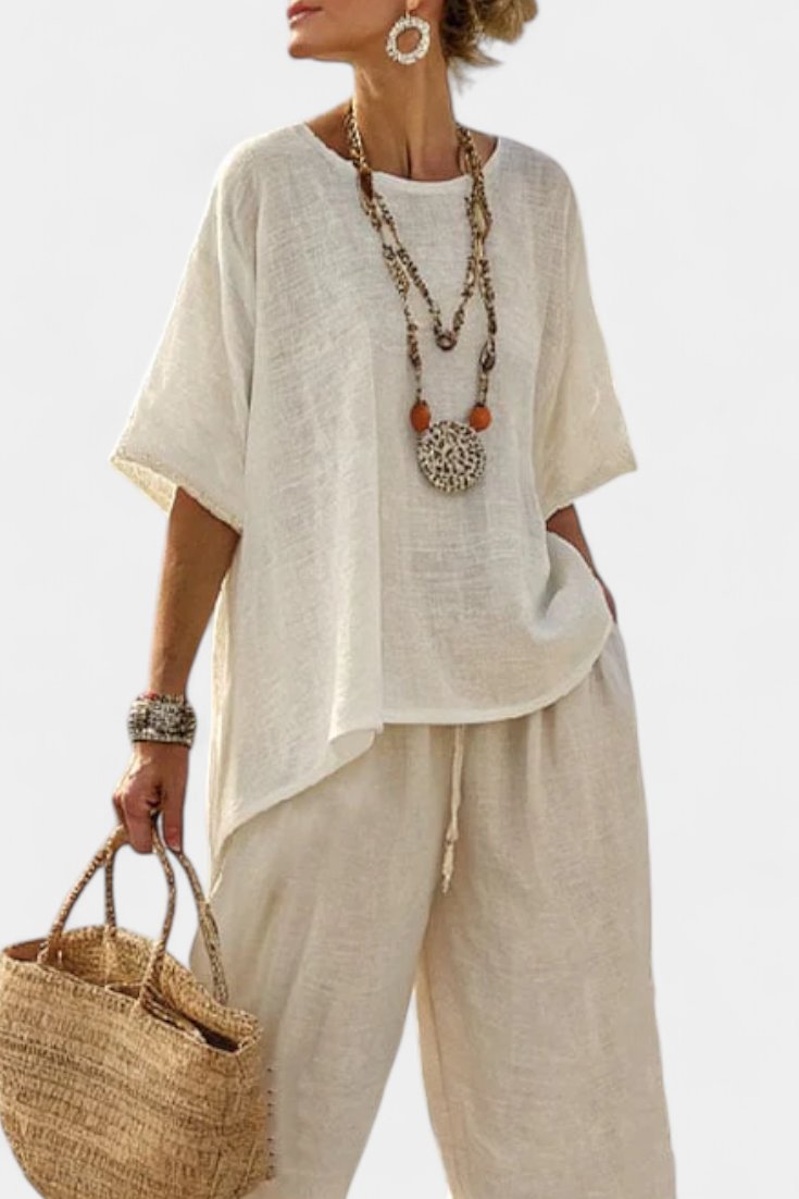 Elegant women's asymmetrical two-piece set; comfortable, relaxed fit for effortless casual style & summer wear.