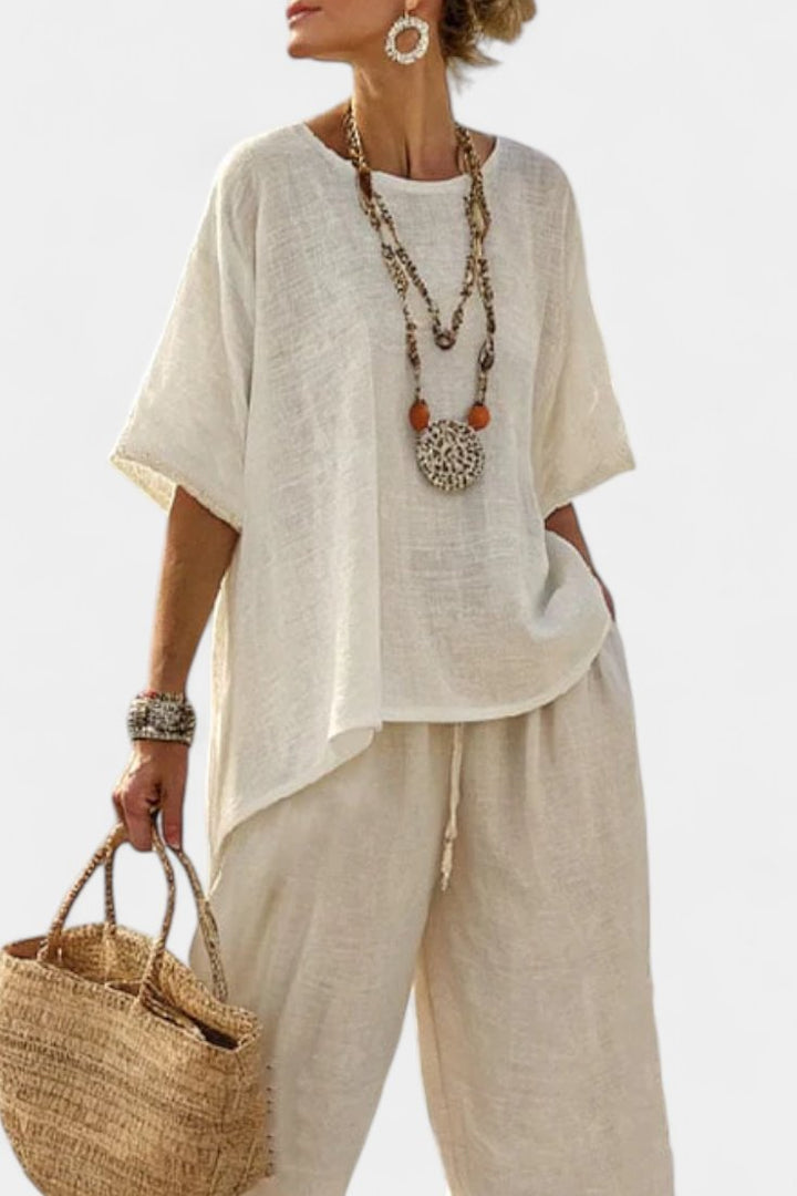 Elegant women's asymmetrical two-piece set; comfortable, relaxed fit for effortless casual style & summer wear.