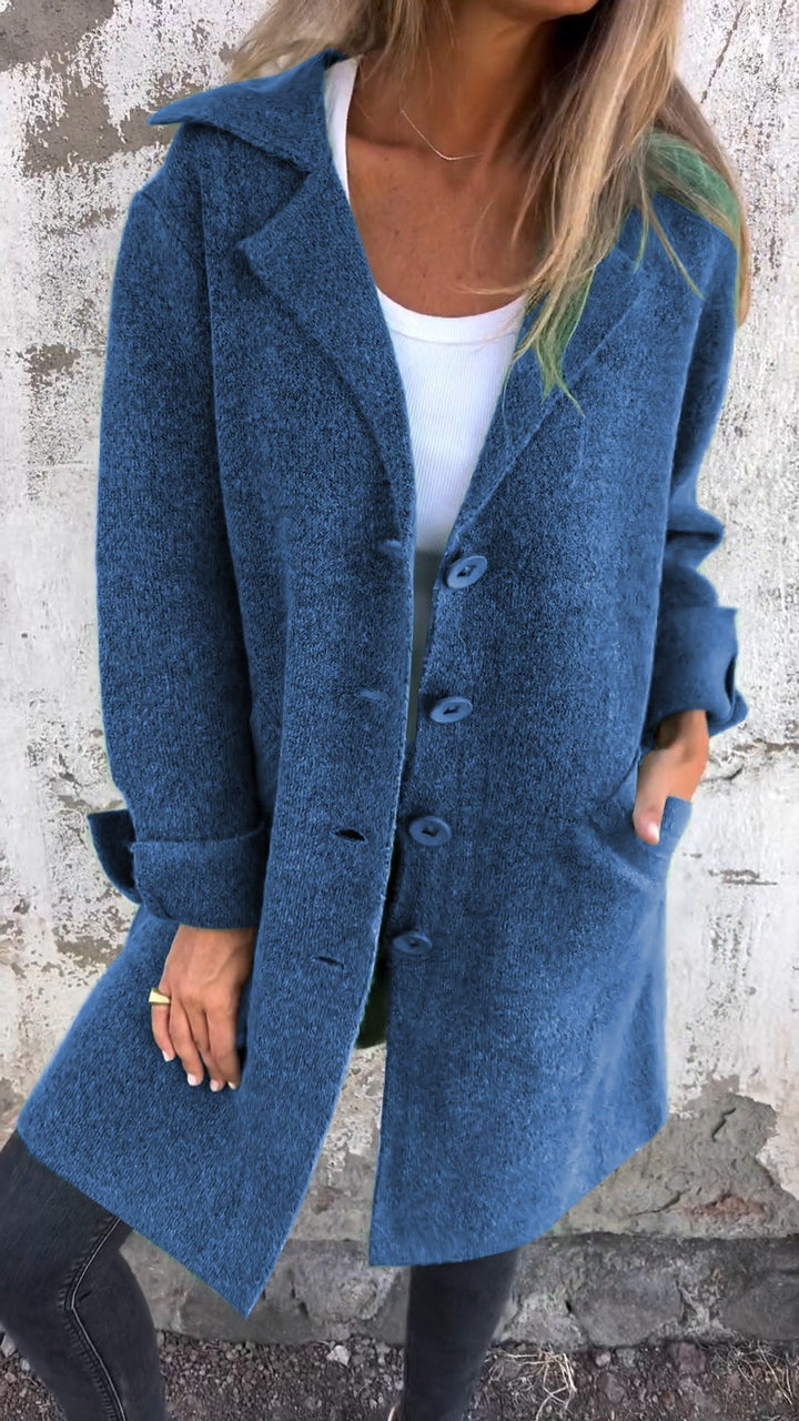 Stylish women's long button coat. Comfortable autumn outerwear, a chic choice for elegant fall fashion.