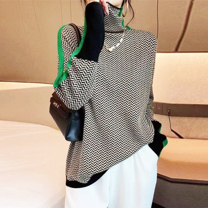 Women's cozy oversized turtleneck sweater with classic houndstooth pattern. Soft, long-sleeve knit for autumn.
