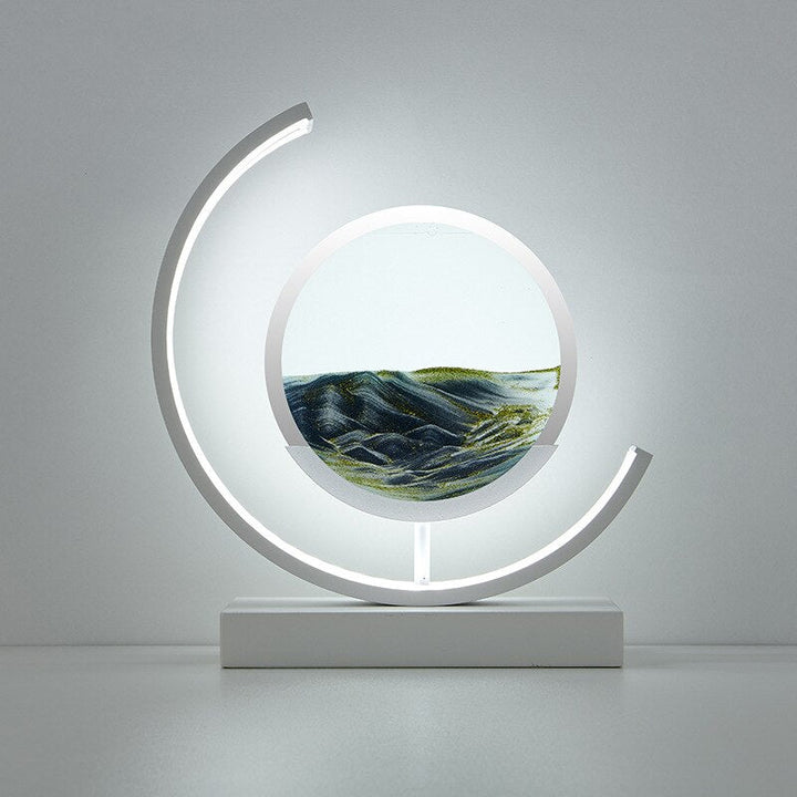 Unique gift: Illuminated moving sand art table lamp, a mesmerizing kinetic display for any room.