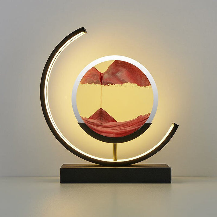 Decorative illuminated sand art display, a kinetic moving sand table lamp for soothing relaxation.