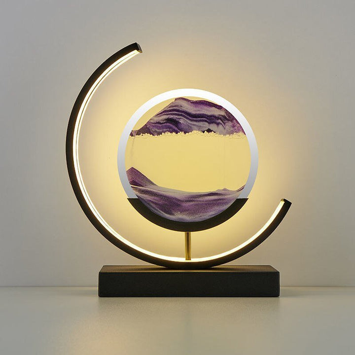 Elegant illuminated moving sand art display, a unique kinetic sculpture for contemporary home decor.