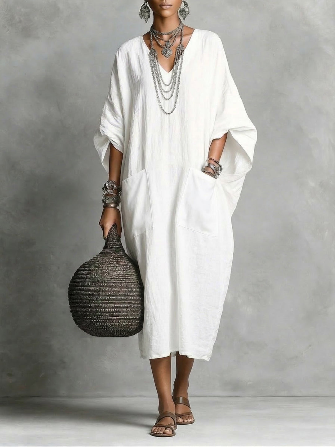 Elegant v-neck kaftan maxi dress, ideal for beach cover-up, vacation style, or comfortable summer wear.