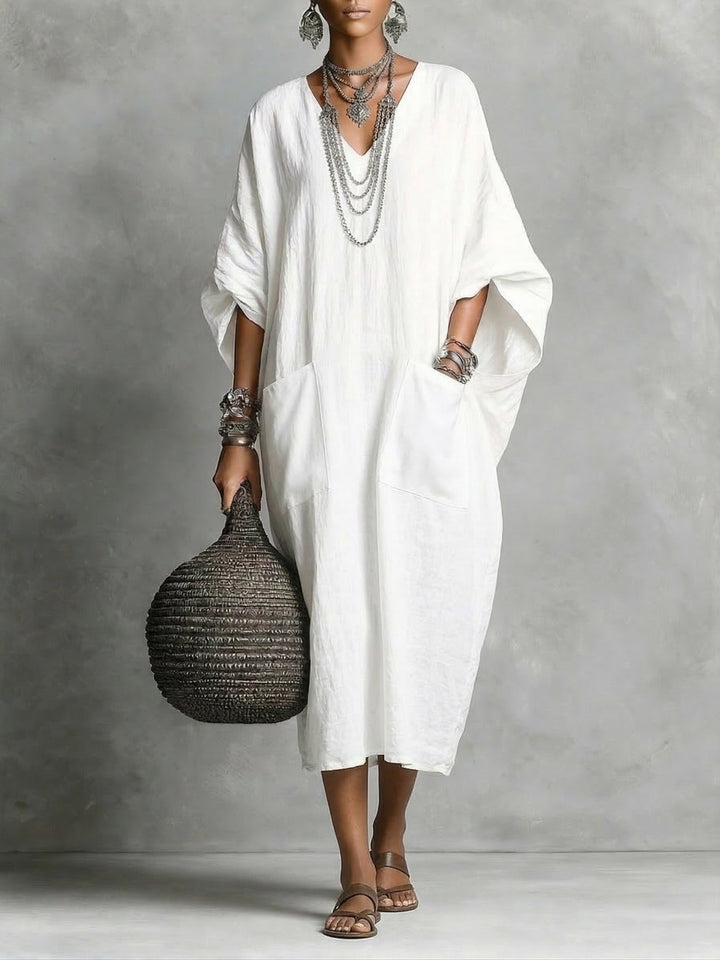 Elegant v-neck kaftan maxi dress, ideal for beach cover-up, vacation style, or comfortable summer wear.