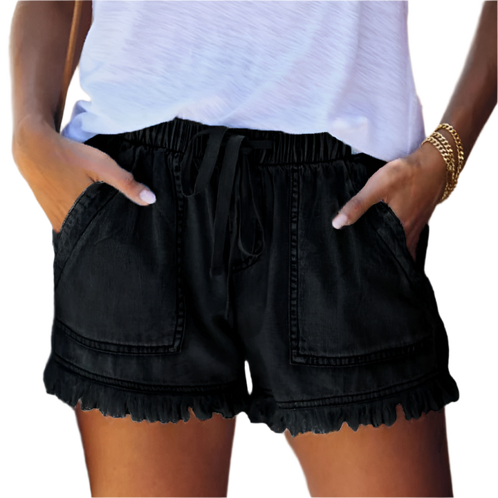 Women's high-waisted denim shorts with a stylish fringe hem. Perfect for summer casual wear.