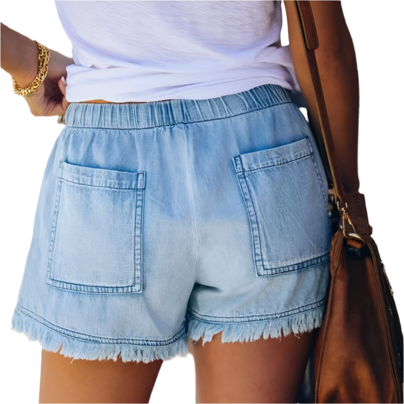 Trendy high-waisted denim shorts for women, featuring a unique fringe hem for boho summer style.