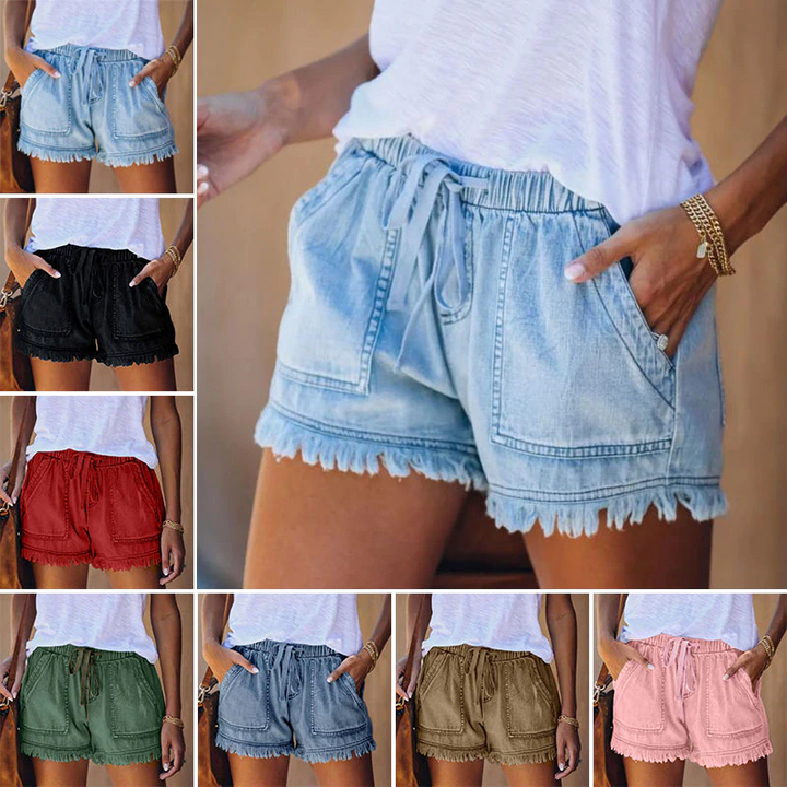 Relaxed fit high-waisted denim shorts for women, with a chic fringe hem. Ideal for casual summer outings.