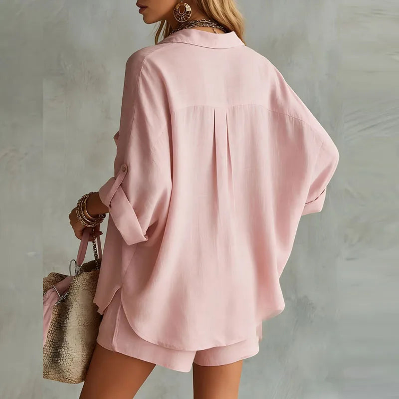Soft fabric women's two-piece set featuring an oversized shirt and high-waisted shorts for comfortable loungewear.