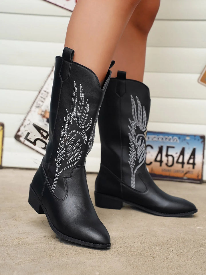 Chic women's cowboy boots, western fashion with elegant stitching, pointed toe, and low heel.