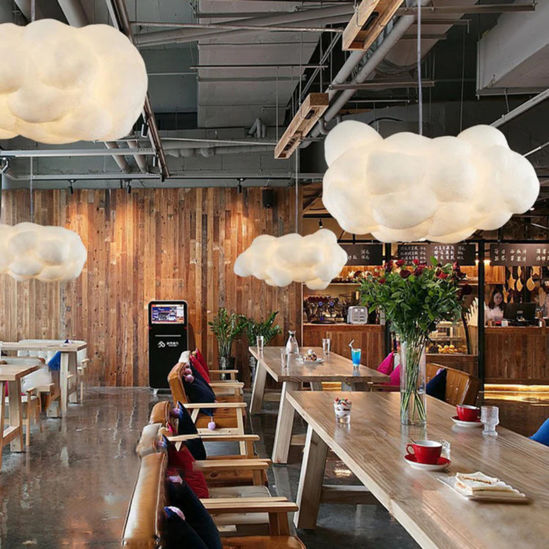 Unique cloud design LED pendant light, white, enhances contemporary home decor.