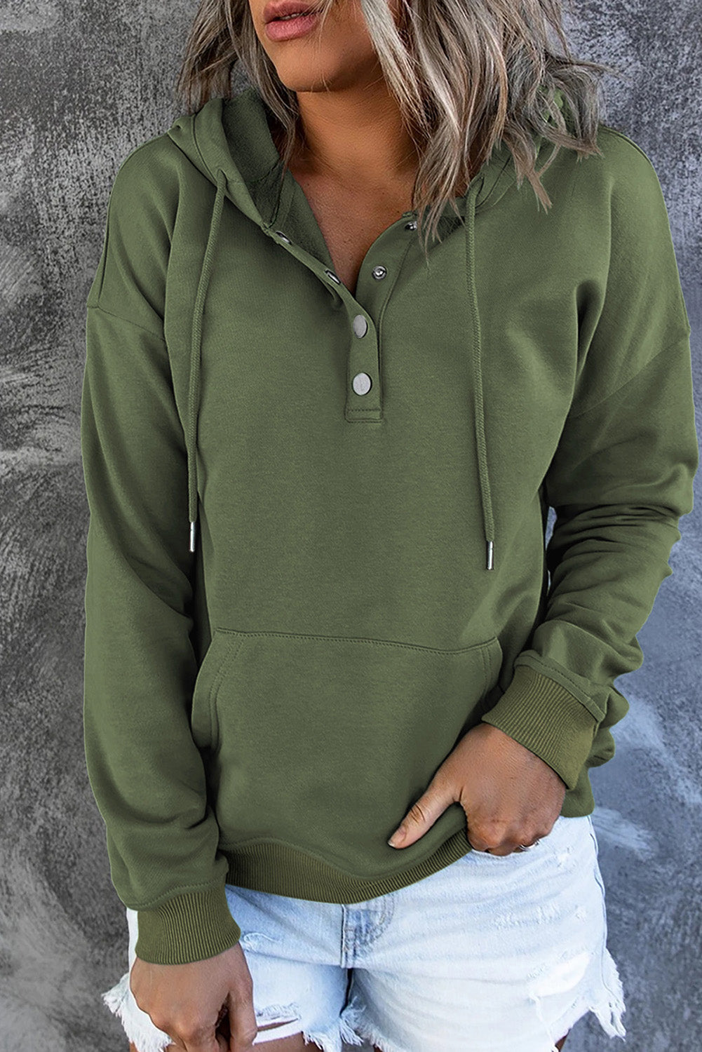 Woman in a comfy hooded sweater, perfect for casual outings & everyday wear.