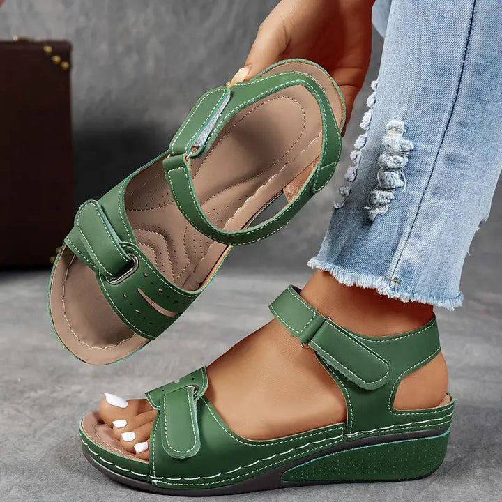 Stylish women's wedge sandals, cushioned for all-day comfort, perfect for summer casual or dressy events.