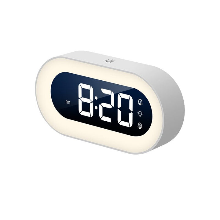 Compact travel alarm clock featuring a clear LED display and a soothing night light
