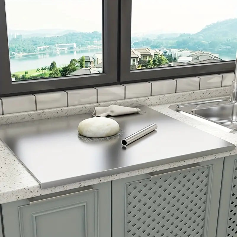 Double-sided stainless steel chopping board for hygienic kitchen food prep. Durable & easy to clean.