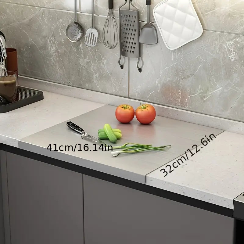 Durable stainless steel cutting board, a key kitchen tool. Non-slip for safe and efficient food prep.