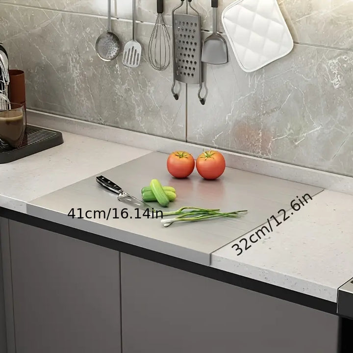 Durable stainless steel cutting board, a key kitchen tool. Non-slip for safe and efficient food prep.