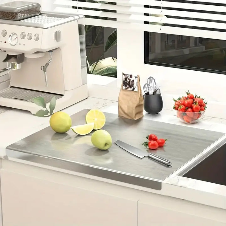 Modern double-sided stainless steel chopping board for professional kitchen food prep. Hygienic cookware.