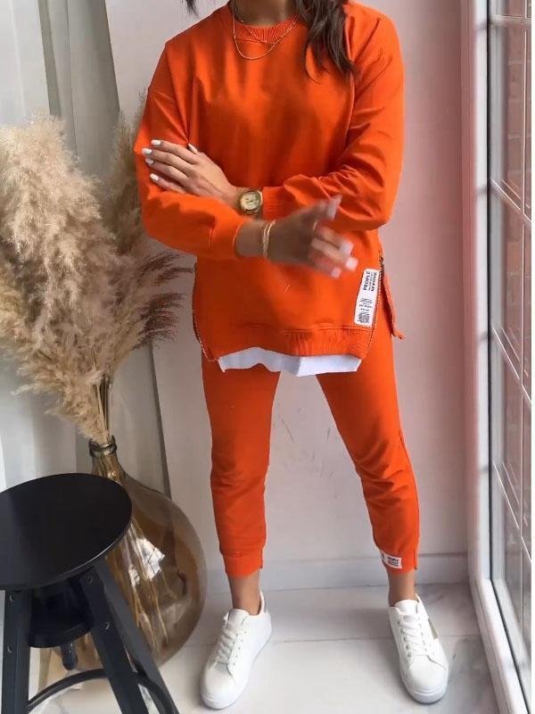 Grey women's cozy loungewear set, a two-piece relaxed fit tracksuit for ultimate comfort & style.