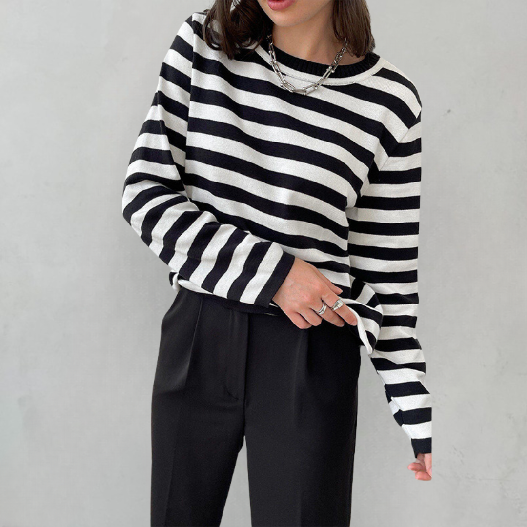 Soft knit women's striped sweater. Comfortable long sleeve crew neck pullover for cozy, effortless fashion.
