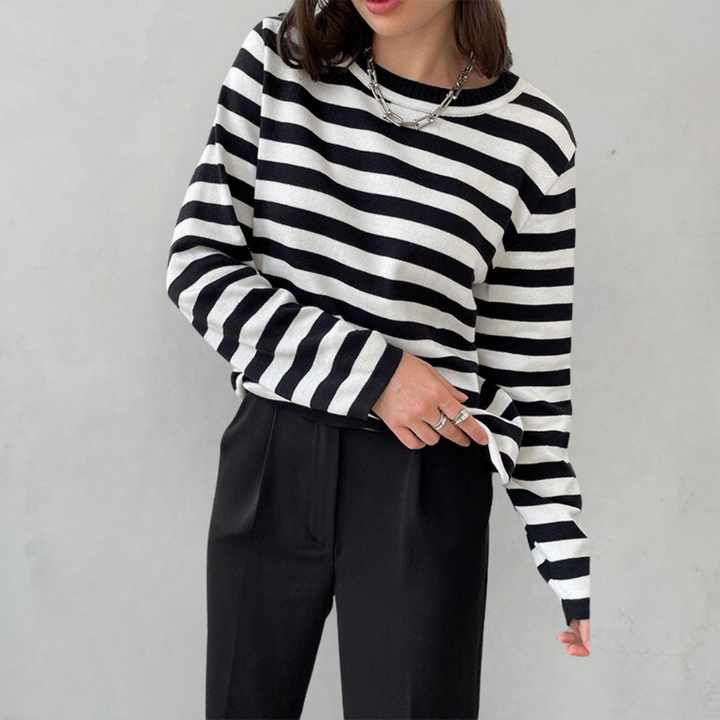 Soft knit women's striped sweater. Comfortable long sleeve crew neck pullover for cozy, effortless fashion.