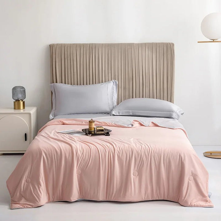 Soft, double-sided cooling blanket provides comfortable, breathable sleep for relaxation.
