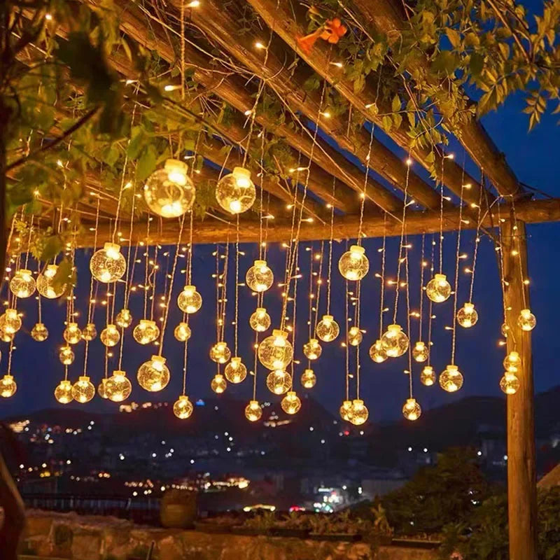 Cozy warm white LED string lights creating a welcoming ambiance on an outdoor patio. Waterproof, ideal for evening decor.