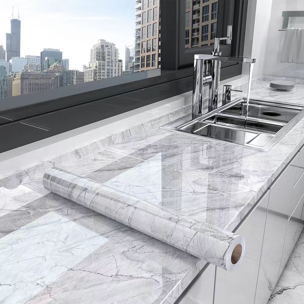 Decorative marble self-adhesive kitchen wrap. Waterproof & oil-resistant film protects countertops and upgrades kitchen decor.