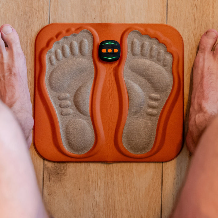 Portable neuropathy stimulator for easy at-home foot pain relief & circulation enhancement.