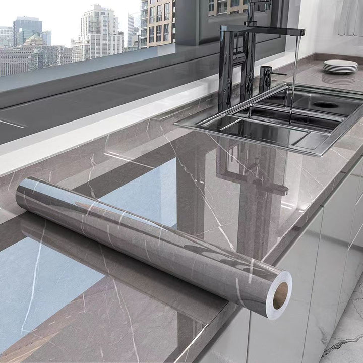 Self-adhesive marble kitchen wrap, waterproof & oil-resistant, for countertop protection & decor. Peel and stick.