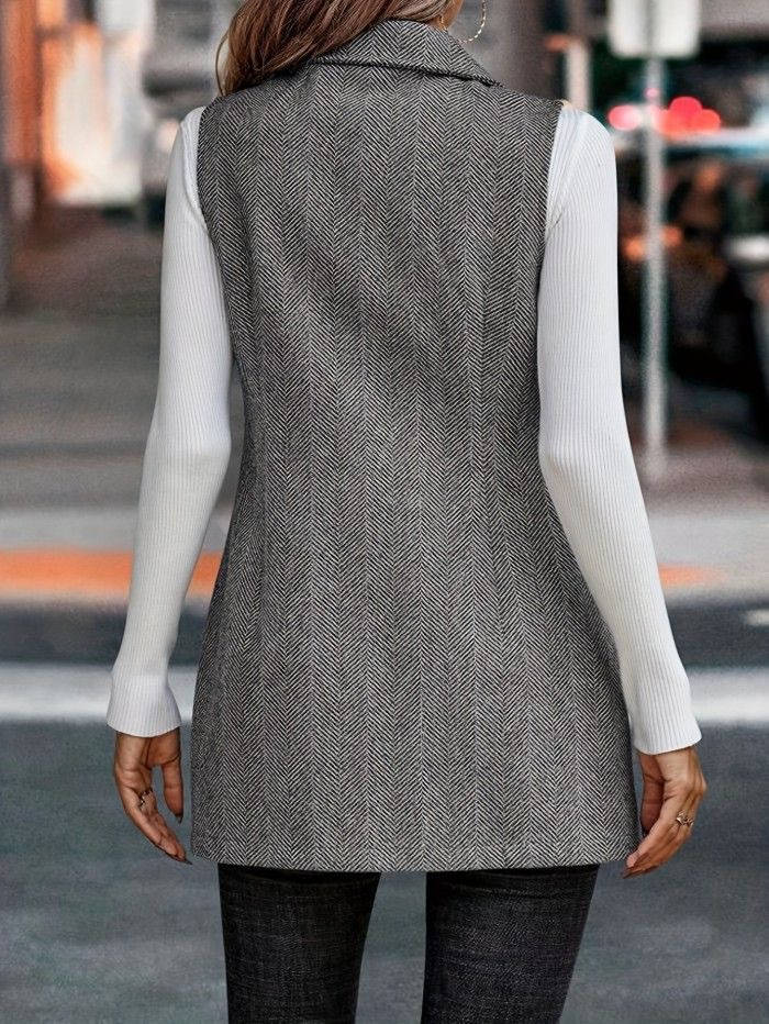 Full length shot of women's double breasted vest blazer with classic lapel, styled over a shirt.
