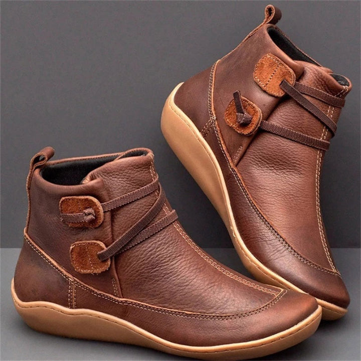 Women's orthopedic waterproof ankle boots, offering comfort and arch support for all-weather wear.