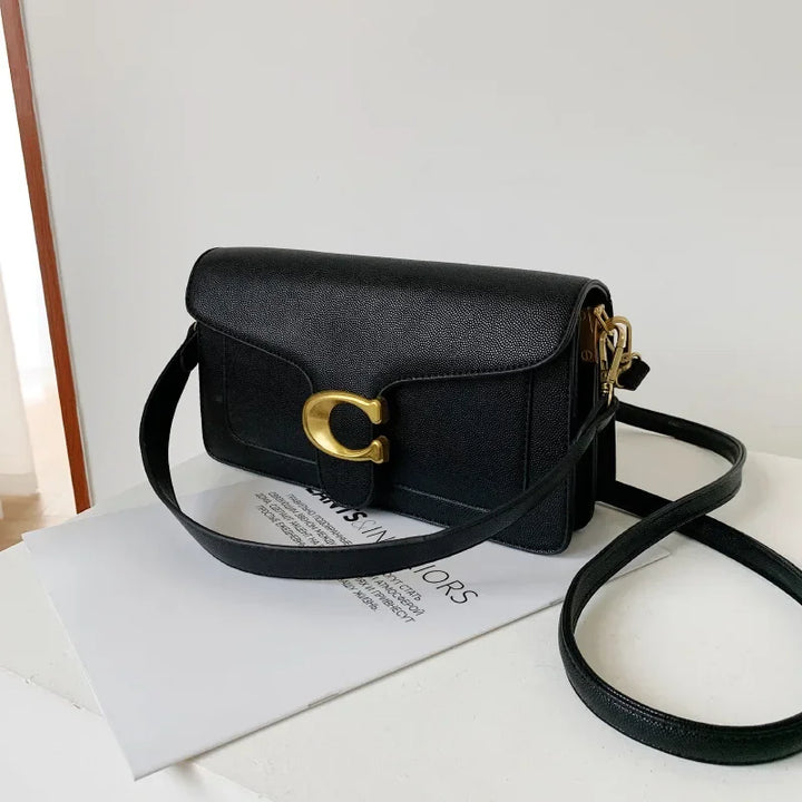 Interior of organized women's elegant everyday handbag. Stylish purse for ample storage of daily essentials.