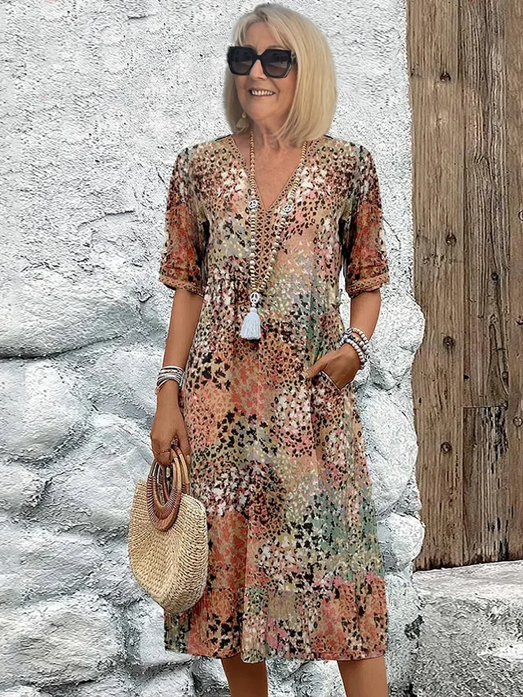 Comfortable & flowing vibrant women's midi dress, versatile for casual or elegant summer looks.