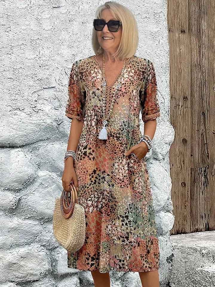 Comfortable & flowing vibrant women's midi dress, versatile for casual or elegant summer looks.