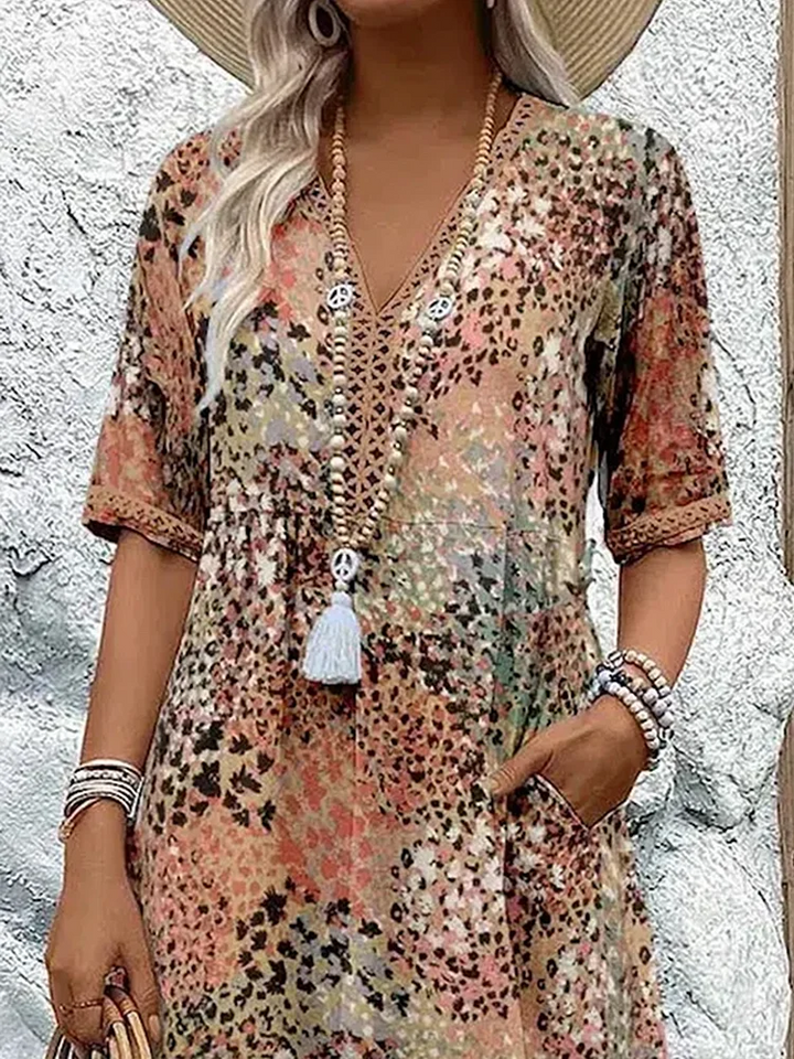 Women's elegant vibrant midi dress, with a flowing design ideal for summer and party wear.