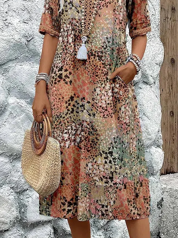 Luxurious vibrant flowing midi dress for women, an elegant statement piece for summer and events.