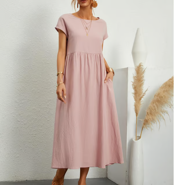 Loose-fit A-line sleeveless summer dress for women, featuring a crew neck and practical pockets.