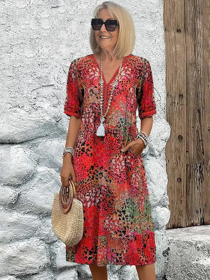 Vibrant flowing women's midi dress, a stylish and comfortable choice for casual summer days.