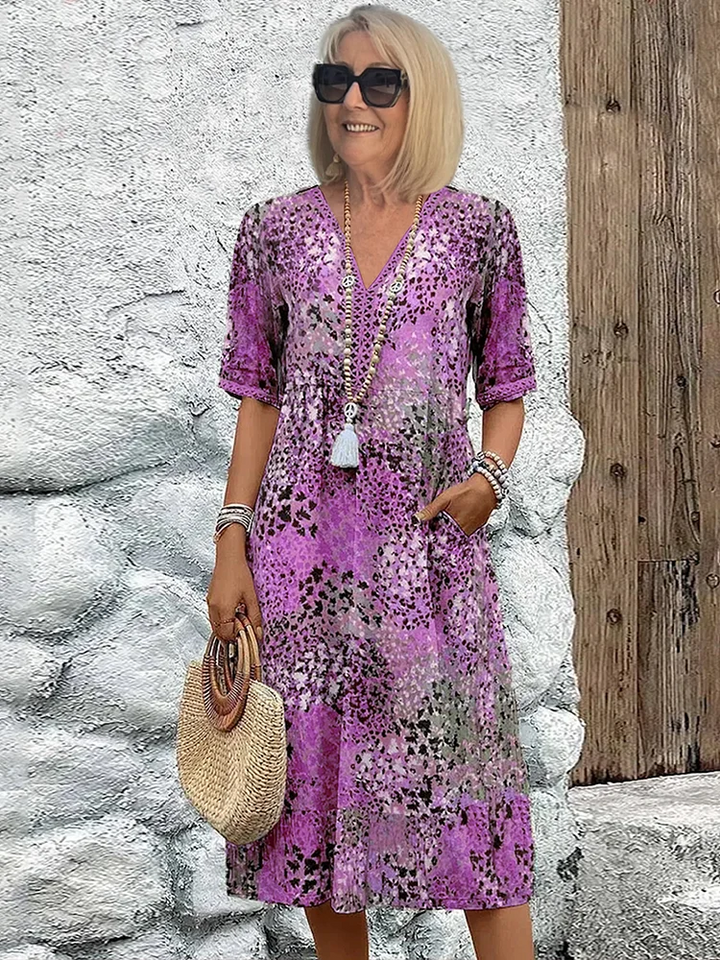 Stylish pink vibrant flowing midi dress, an elegant women's party dress option.